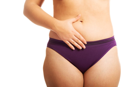 Woman's fat belly in underwear