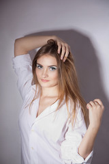 Fototapeta premium Face of a beautiful young woman with bright blue eyes