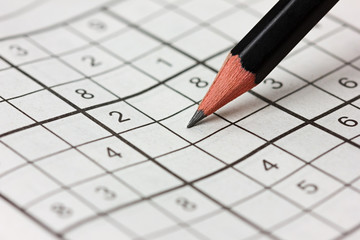 crossword sudoku and pencil, popular puzzle game with numbers