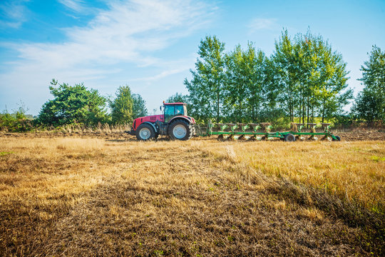 agricultural processing tractor plowing field