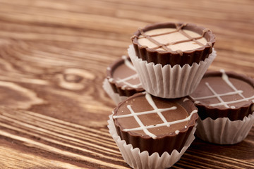 Dark chocolate on wooden background