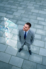 young smiling businessman outdoors from top