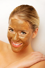 Portrait of happy woman with chocolate mask