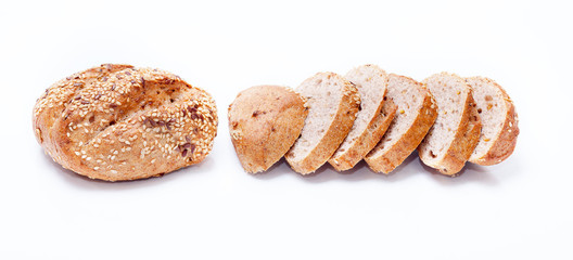 Fresh whole grain bread cut in half on white background
