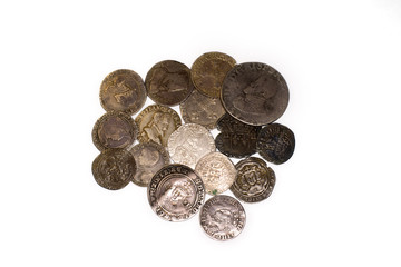 Vintage silver coins with portraits on a white background