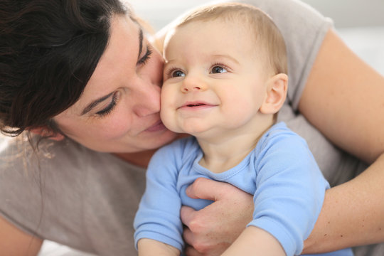 Portrait of happy mother with baby boy