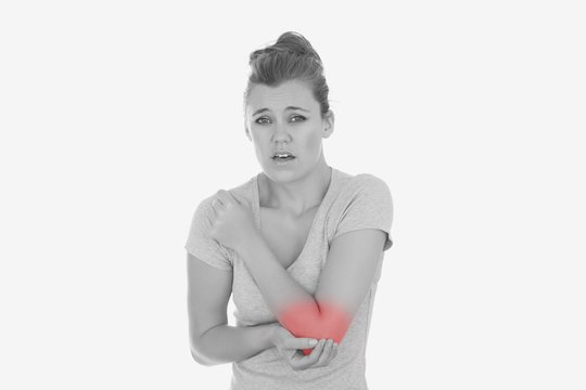 Young woman with elbow pain