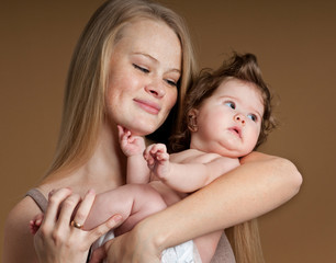 Young mother with a charming baby.Happy cheerful family.