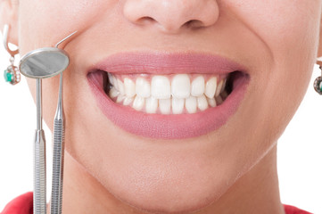 Perfect teeth and dentist tools