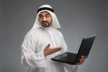 Arab working with laptop