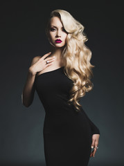 Elegant blonde on black background - 76816463