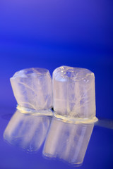 wet ice cubes on blue background