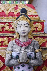 Deva statue with greet act.