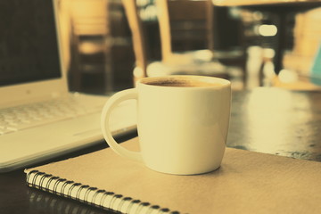 cup of coffee in coffee shop vintage color tone