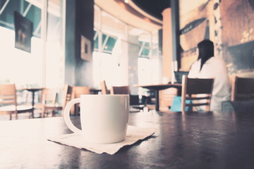 cup of coffee in coffee shop vintage color tone