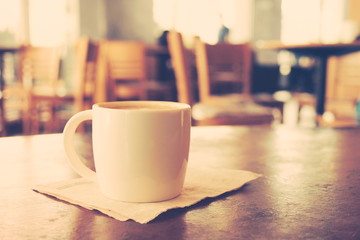 cup of coffee in coffee shop vintage color tone