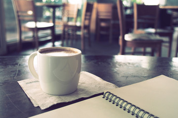 vintage color tone of  cup of coffee  on the table coffee shop