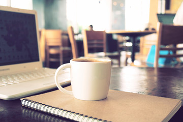 vintage color tone of  cup of coffee  on the table coffee shop