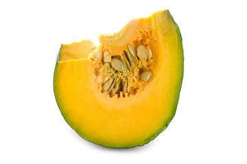piece of fresh pumpkin with seeds on white background