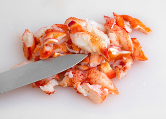 Lobster on a cutting board with a knife