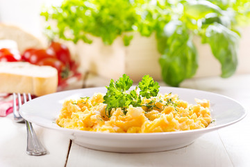 plate of scrambled eggs with parsley
