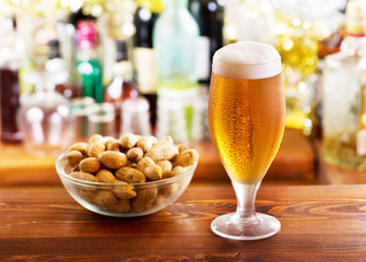 glass of beer with peanuts