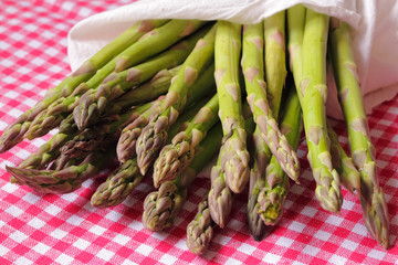 Bunch of fresh asparagus on wooden table