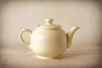 Vintage cream teapot in retro decor