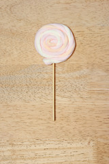 marshmallow on sticks,wood background.
