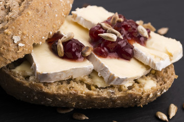 bread served with camembert and cranberry