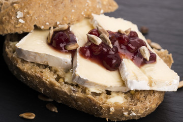 bread served with camembert and cranberry