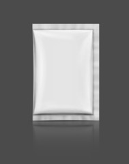 blank foil sachet isolated on gray background