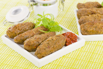 Koftas - Lamb koftas served with harissa. Middle Eastern meal!