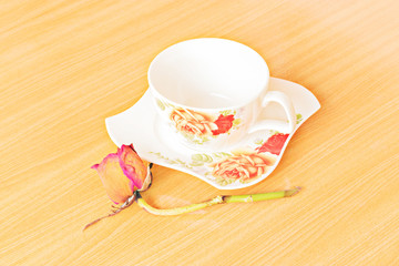 Empty colorful coffee cups on wooden table
