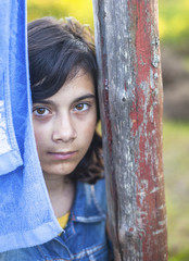 Portrait of pretty young girl in outdoors.