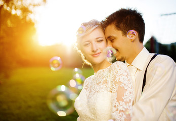 Young wedding couple on a summer meadow