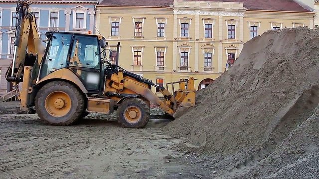 Excavator transports gravel