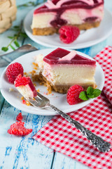 Raspberry cake with fresh fruits on rustic table