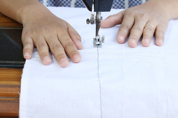 Obraz premium woman working with sewing machine.