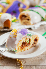 Mardi Gras: Cut Piece Of King Cake Showing Delicious Filling © seanlockephotography