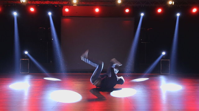 Hip-hop dancer  dances on stage in club