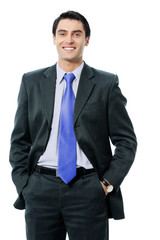 Portrait of young businessman with blue tie, on white