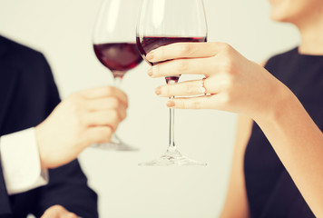 engaged couple with wine glasses