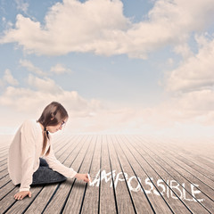 young girl turning the word impossible to possible with chalk