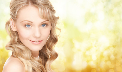 Naklejka premium face of beautiful young happy woman with long hair