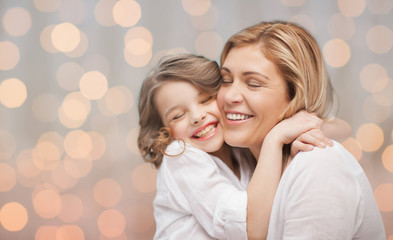 happy mother and daughter hugging