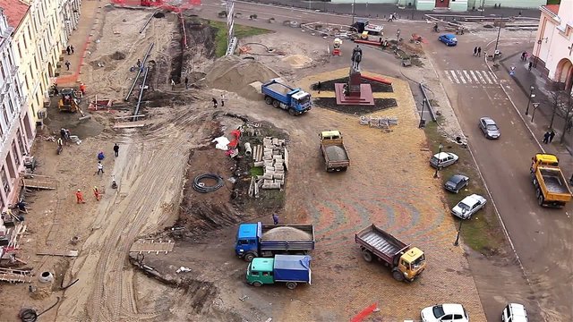 Aerial view of a construction site with workers and machinery