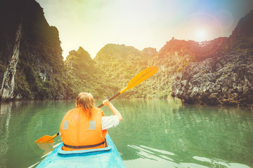 Towards to adventures in a kayak in the picturesque Halong Bay