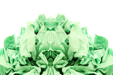 Green crumpled toilet paper on white