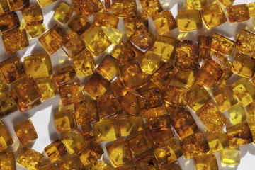 yellow amber stones rectangular closeup lie on a flat surface